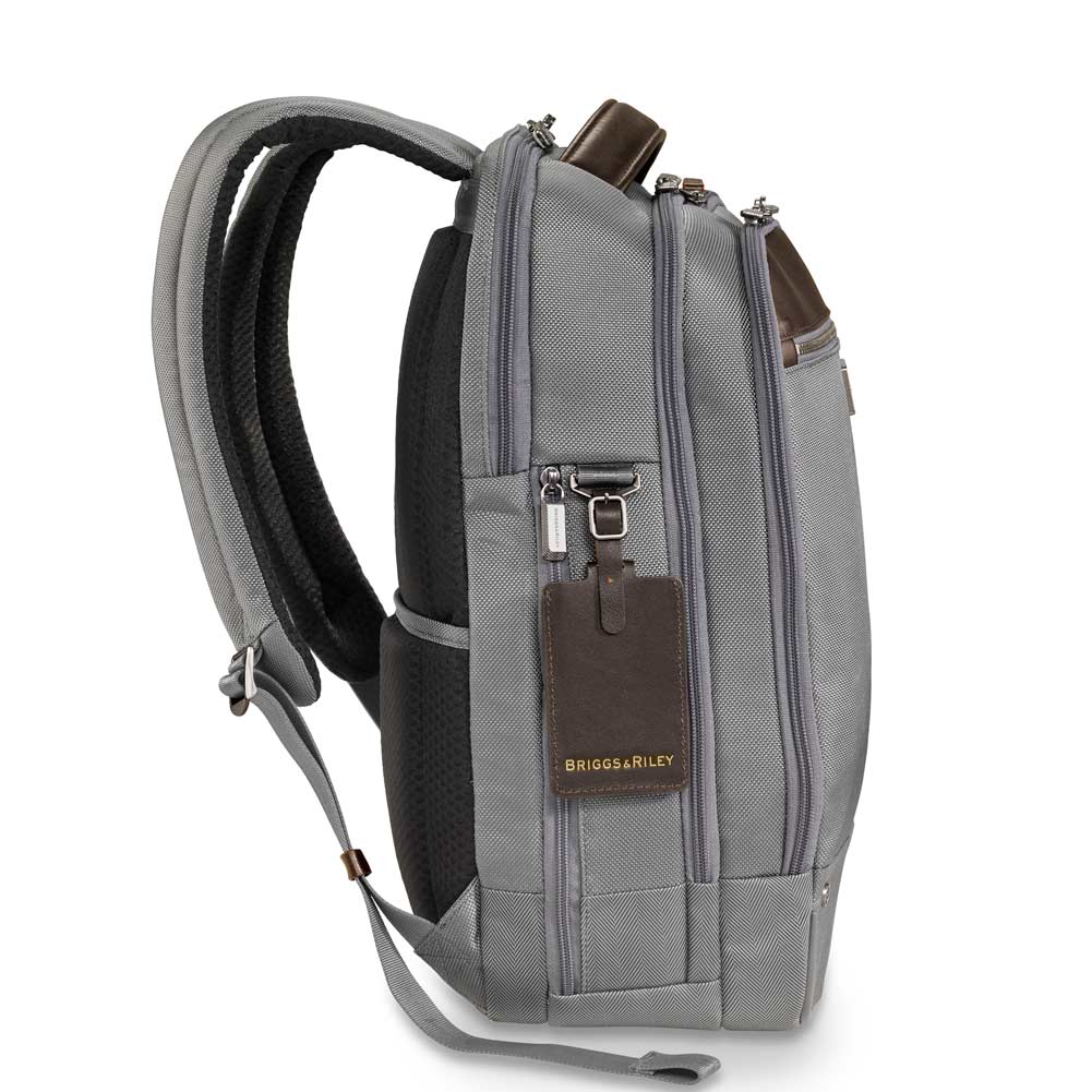grey backpack hanging leather id tag