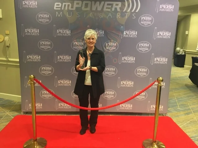 Jill with her Empower Music POSI award