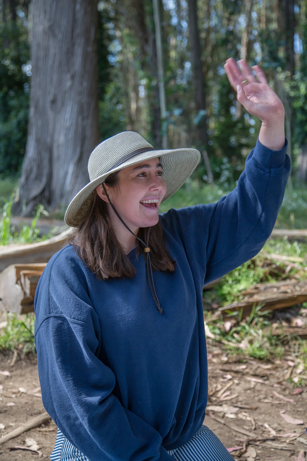 Waving hello to Bob as he rides by on his mountain bike (a daily occurrence at the forest school).