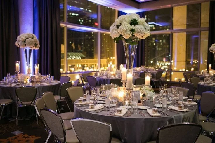 Elegant ballroom at theWit Chicago set for a wedding reception with modern lighting and event design