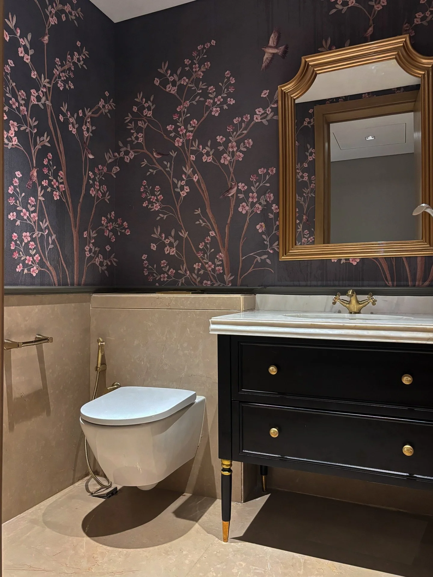 Designed a luxurious maximalist powder bathroom through a detailed renovation! ✨

Swipe left to see the transformation. 

We took out the old vanity unit, and added a fully custom designed vanity unit, topped with a beautiful white marble. The vanity