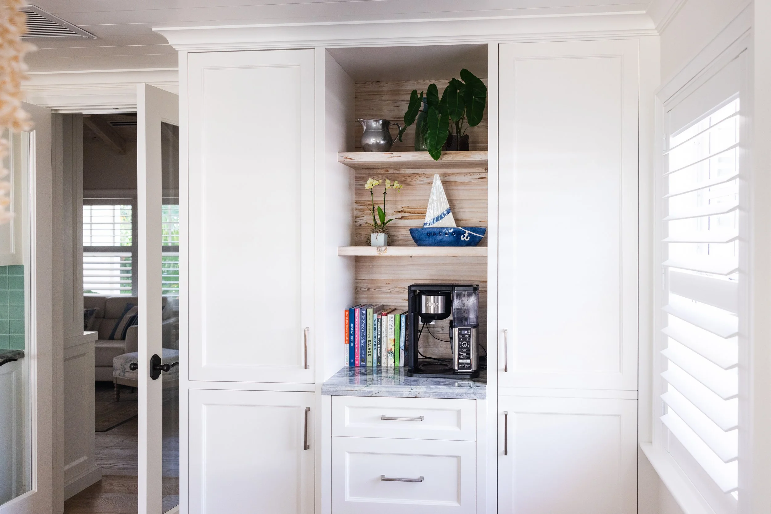 Ocean Breeze property view featuring bright residential finishes, updated design details, and coastal-style presentation.
