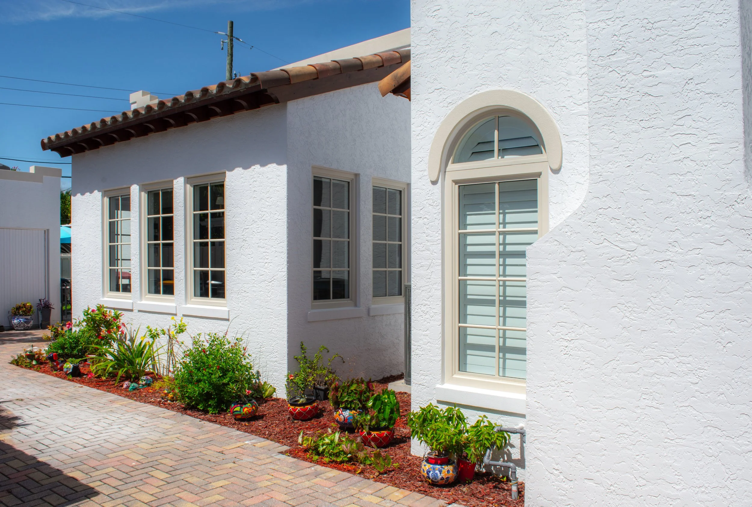 Exterior view of the 227 Fordham property showing the home facade, outdoor architecture, and surrounding residential landscaping.