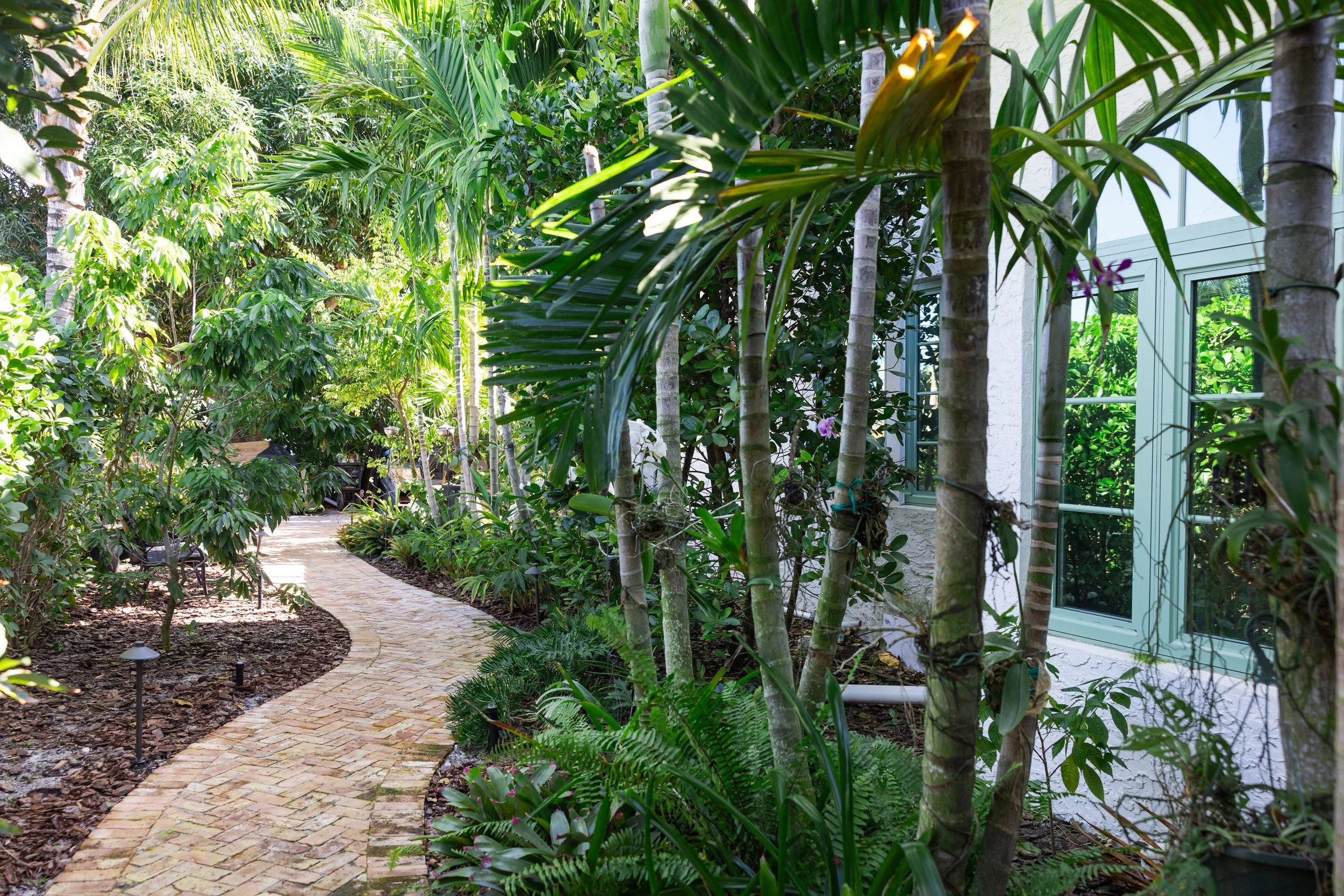Outdoor view of the Lakeside Drive residence with landscaped surroundings and a polished residential exterior.