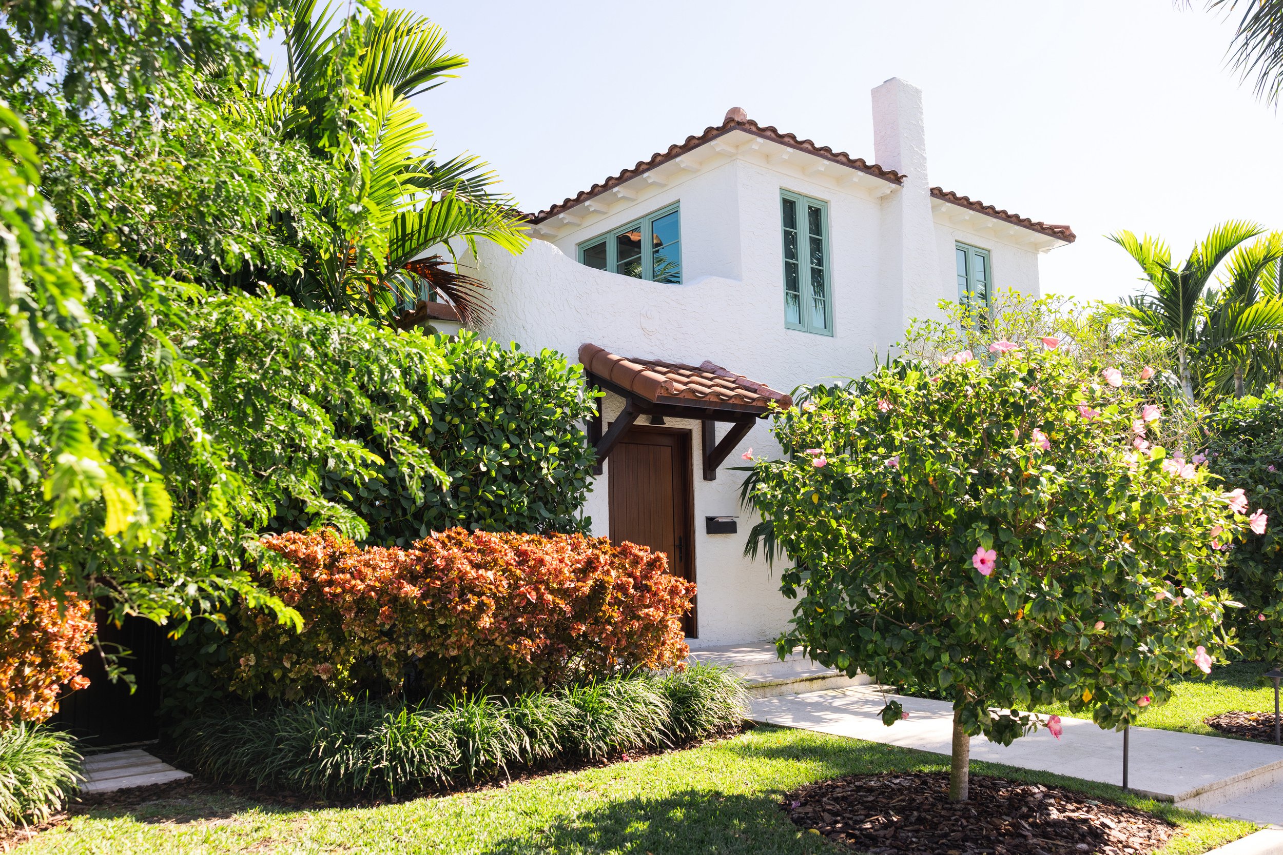 Exterior angle of the Lakeside Drive home with surrounding landscape and refined residential design details.