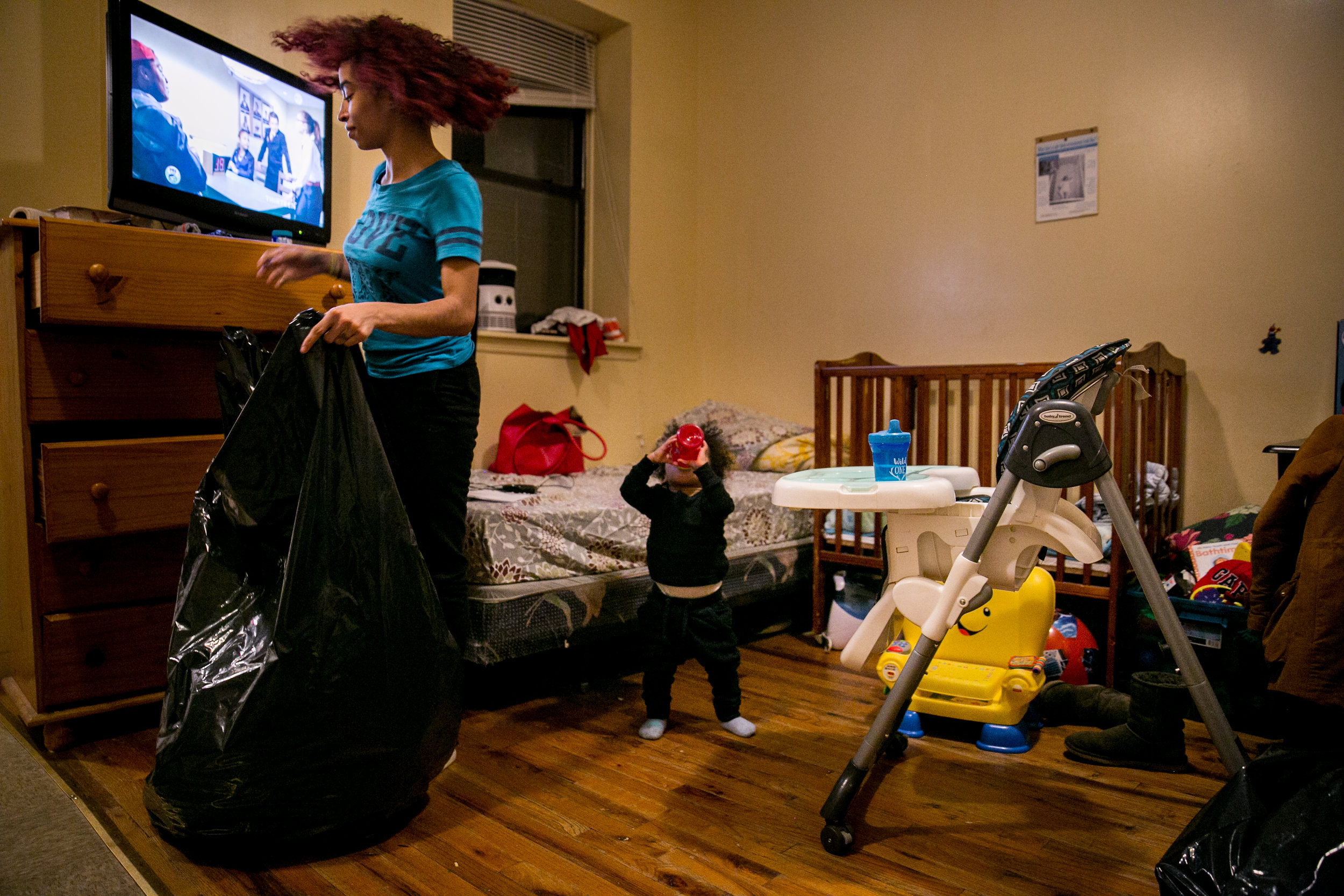  Madelyn Brito packs up her belongings alongside her 1-year-old son Cameron the night before moving out of the Kingston Family Residence homeless shelter in Brooklyn, New York 