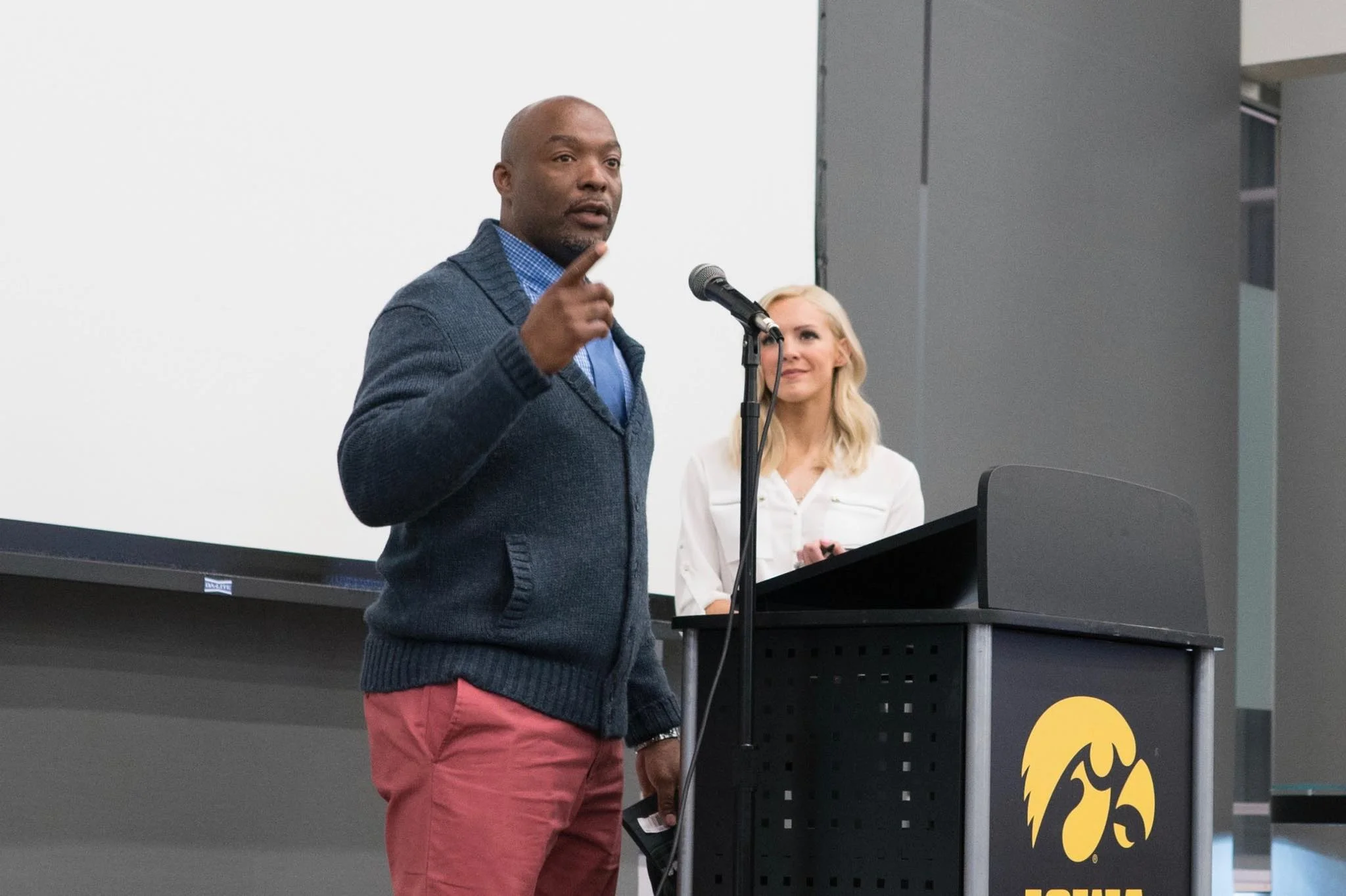 Our Founder Carlos Honore presenting at the 100 Plus Men Who Care Hawkeye Chapter
