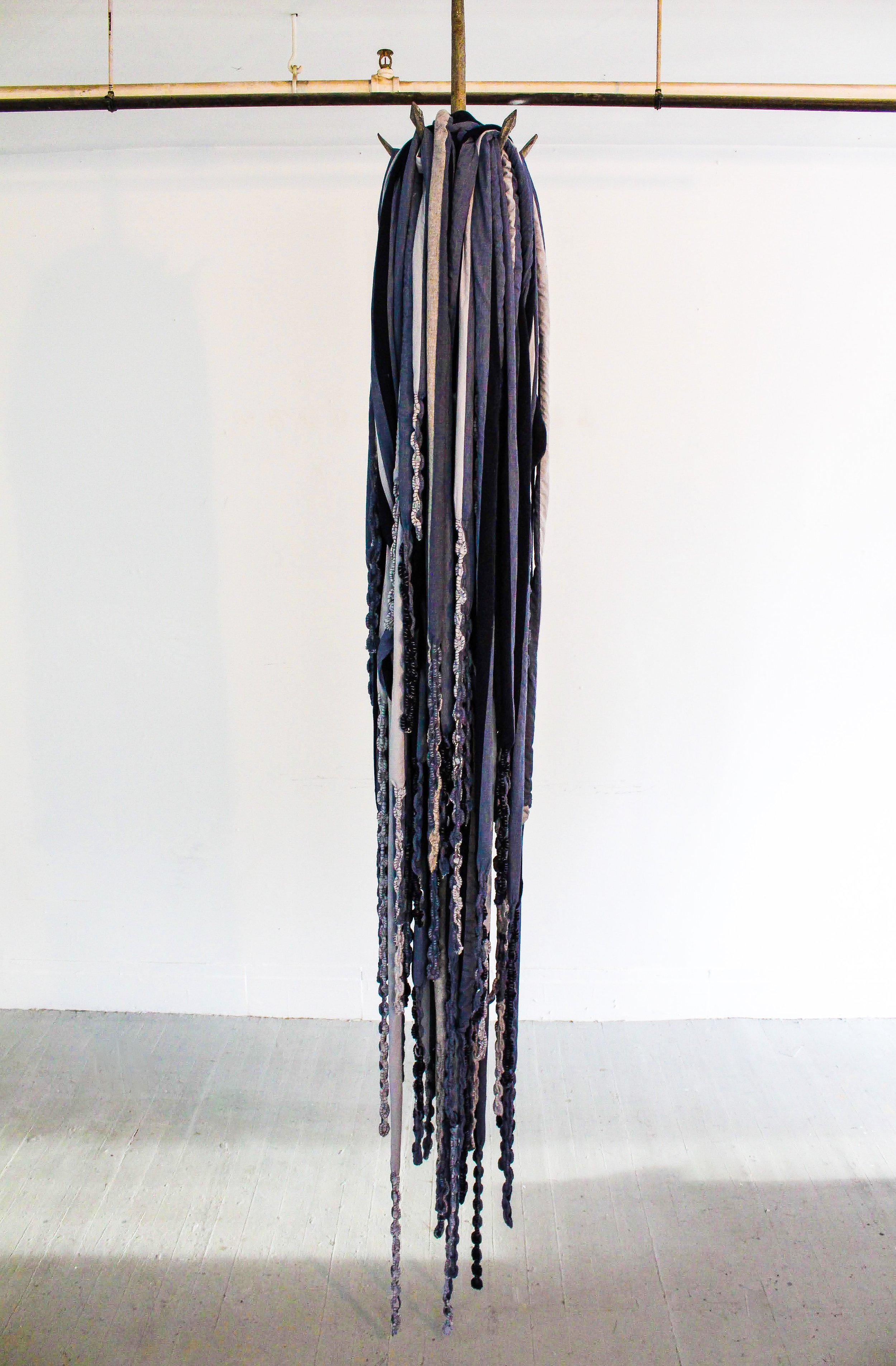    Links  to  an  Amazonian  Bird,    2021.  Anchor,  chain,  fabric,  thread,  video installation.     