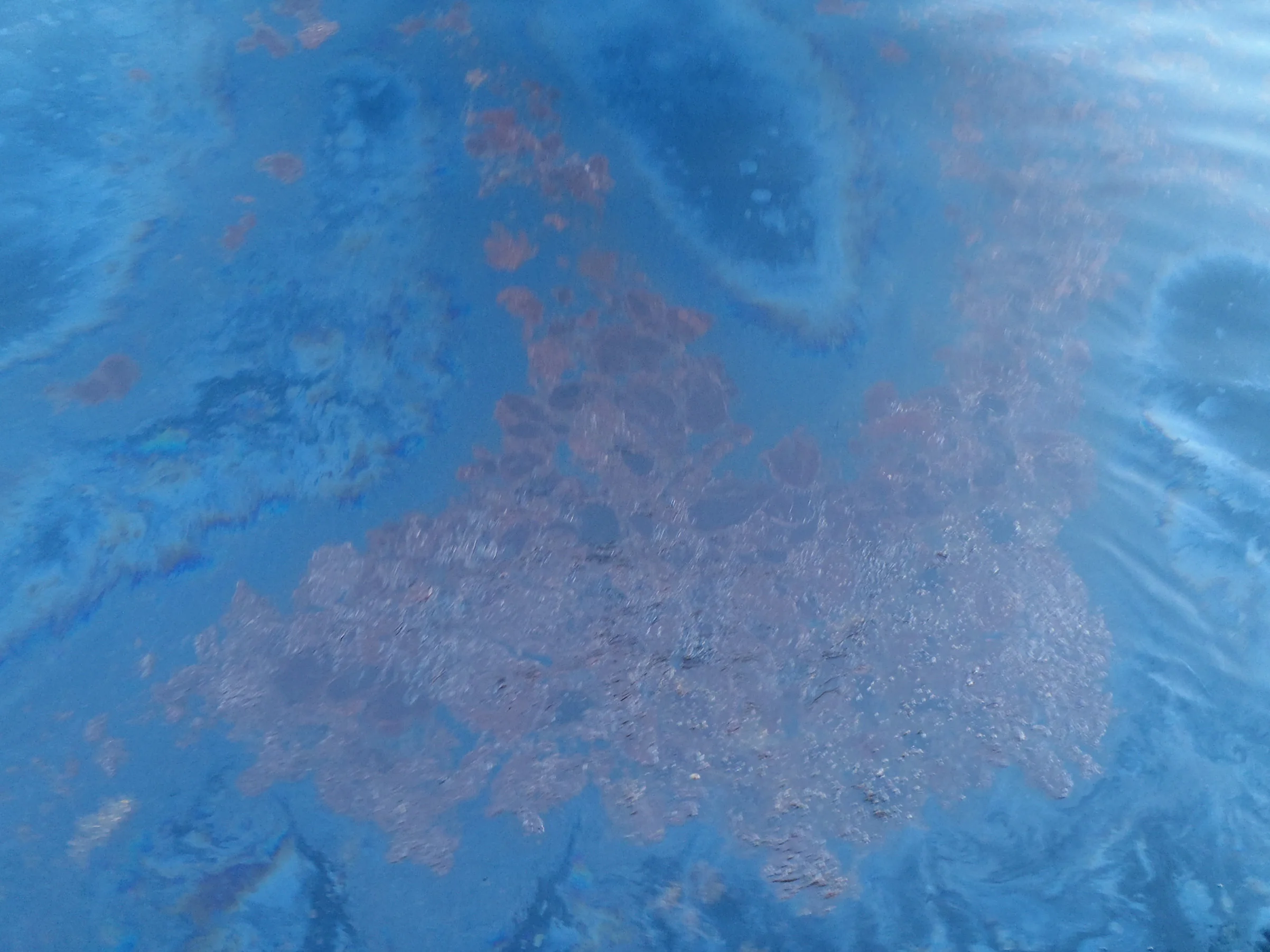 Yet another type of surface oil slick.