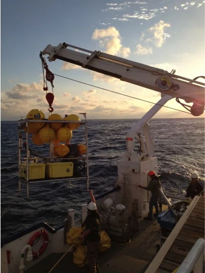 Moving an ECOGIG lander on the RV Pelican at sunset. Photo by Beth Orcutt.