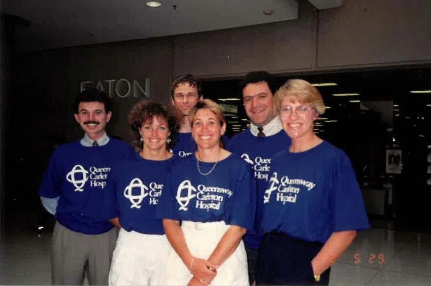 Old QCH Logo-Group Photo.jpg