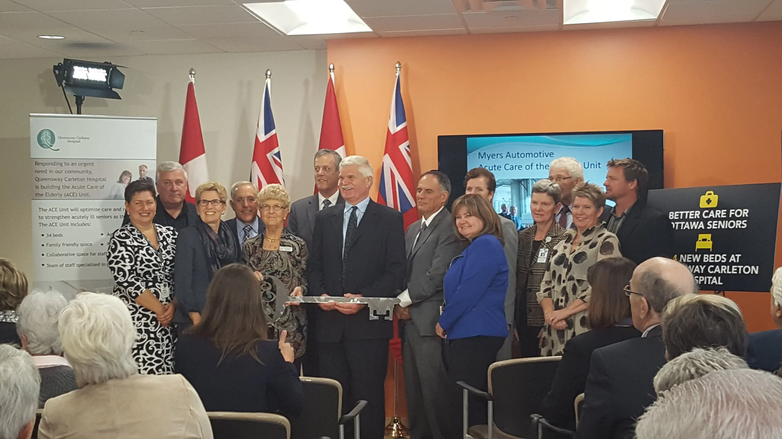 Group of donors and community members speaking at the opening of the ACE Unit, including supporters of the Myers Automotive contribution