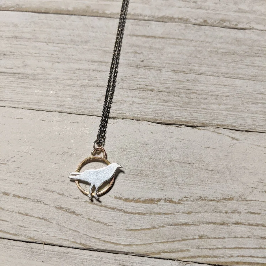 CKJ-raven-side-sit-necklace.jpeg