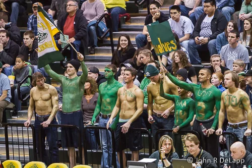 University hockey team attends a volleyball game.