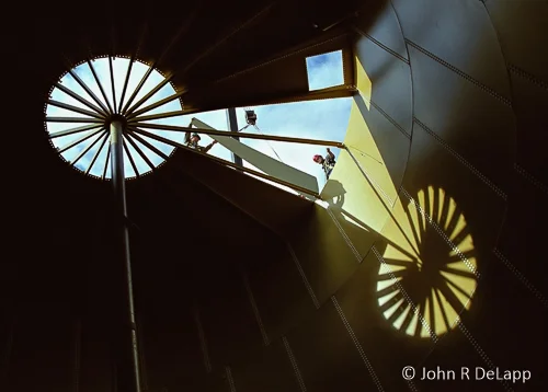 Workers completing roof of water tank, Dillingham, Alaska.