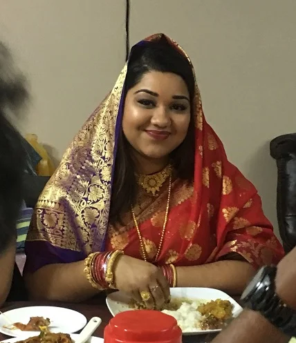 Candid shot of me eating rice and curry as a newlywed bride