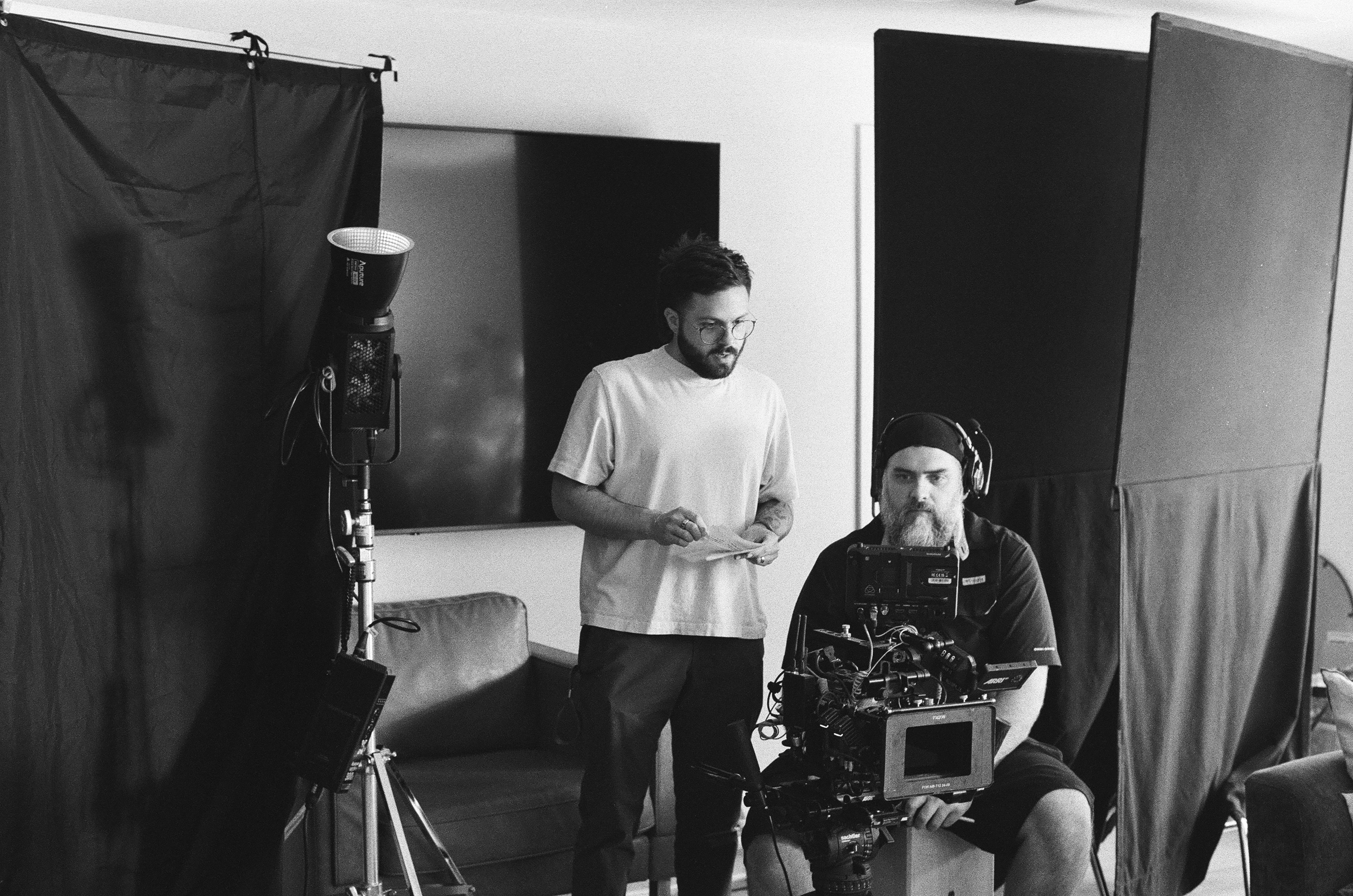 Sam Lowy, a commercial director, works with his director of photography on set