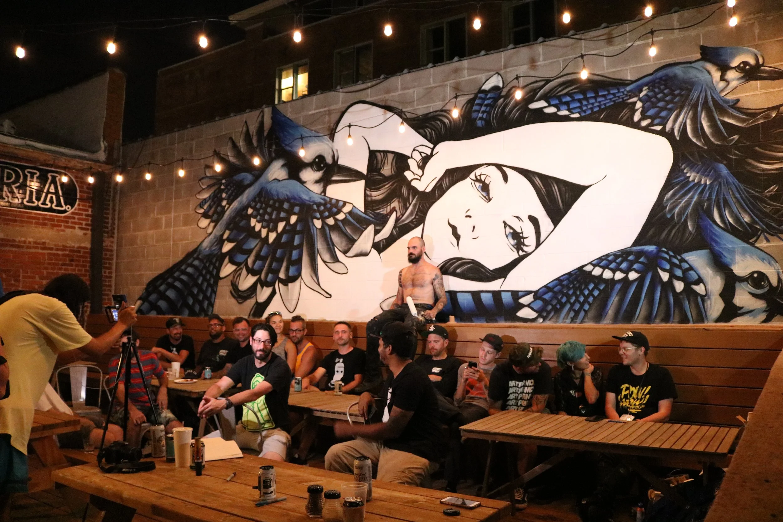  2018 Festival Participants getting ready for a group picture in front of the mural.  Photo by Diana Gonzalez  