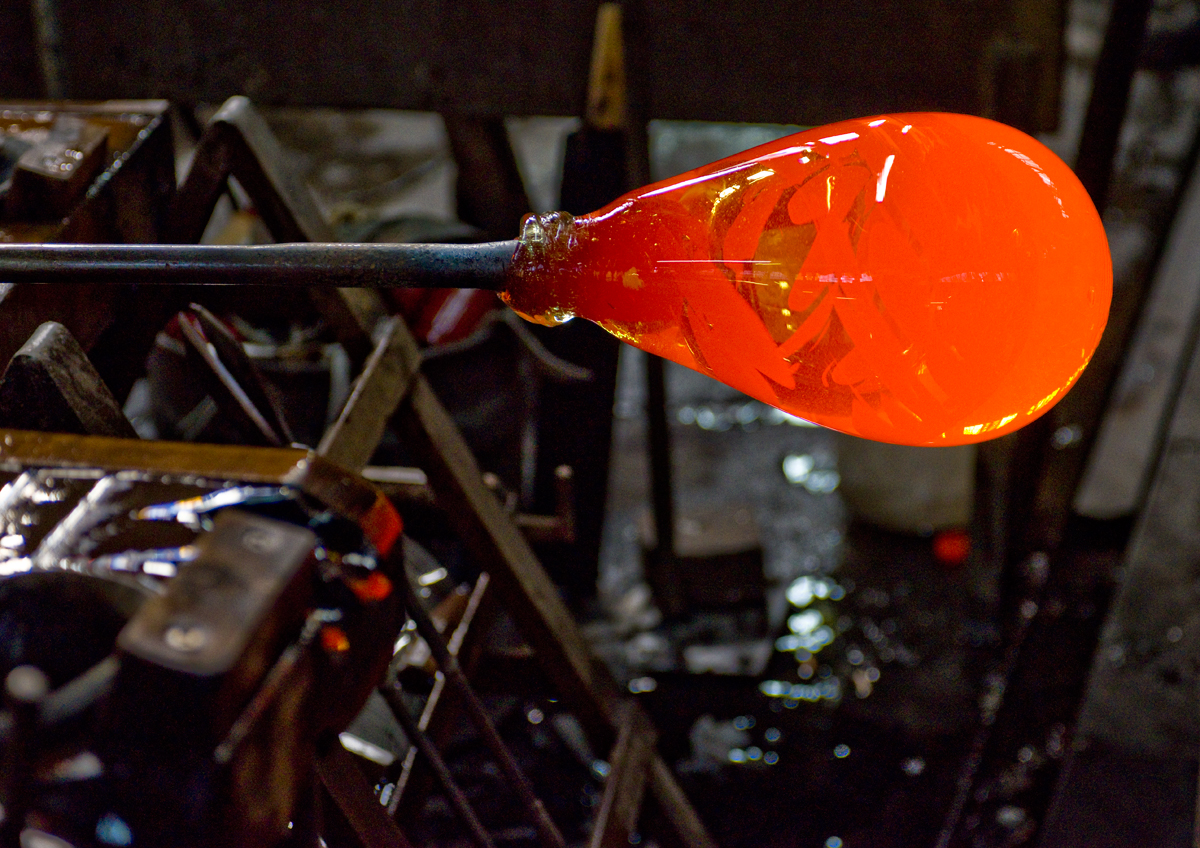 The glass on the end of the blowpipe; ready to be blown to size.