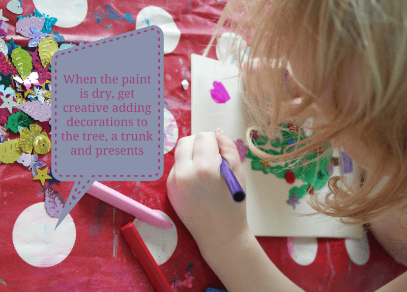 Get-creative-adding-decorations-to-the-tree-a-trunk-and-presents.png