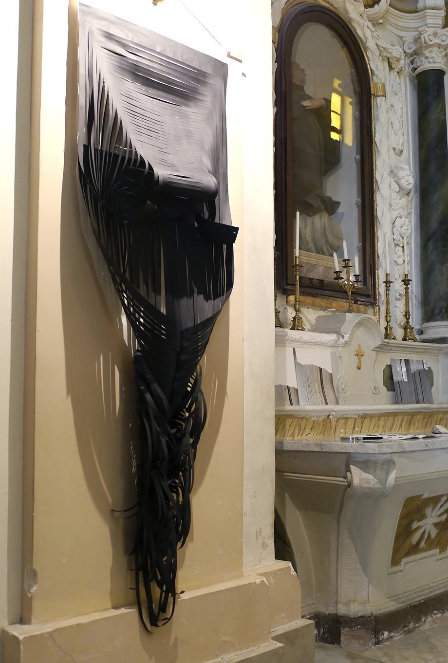 Dark Flow 2, black paper sculpture approximately 2 metres tall.