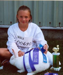 MCKENNA MERTENS, 9, WI, WITH HER WHITE FLEMISH GIANT
