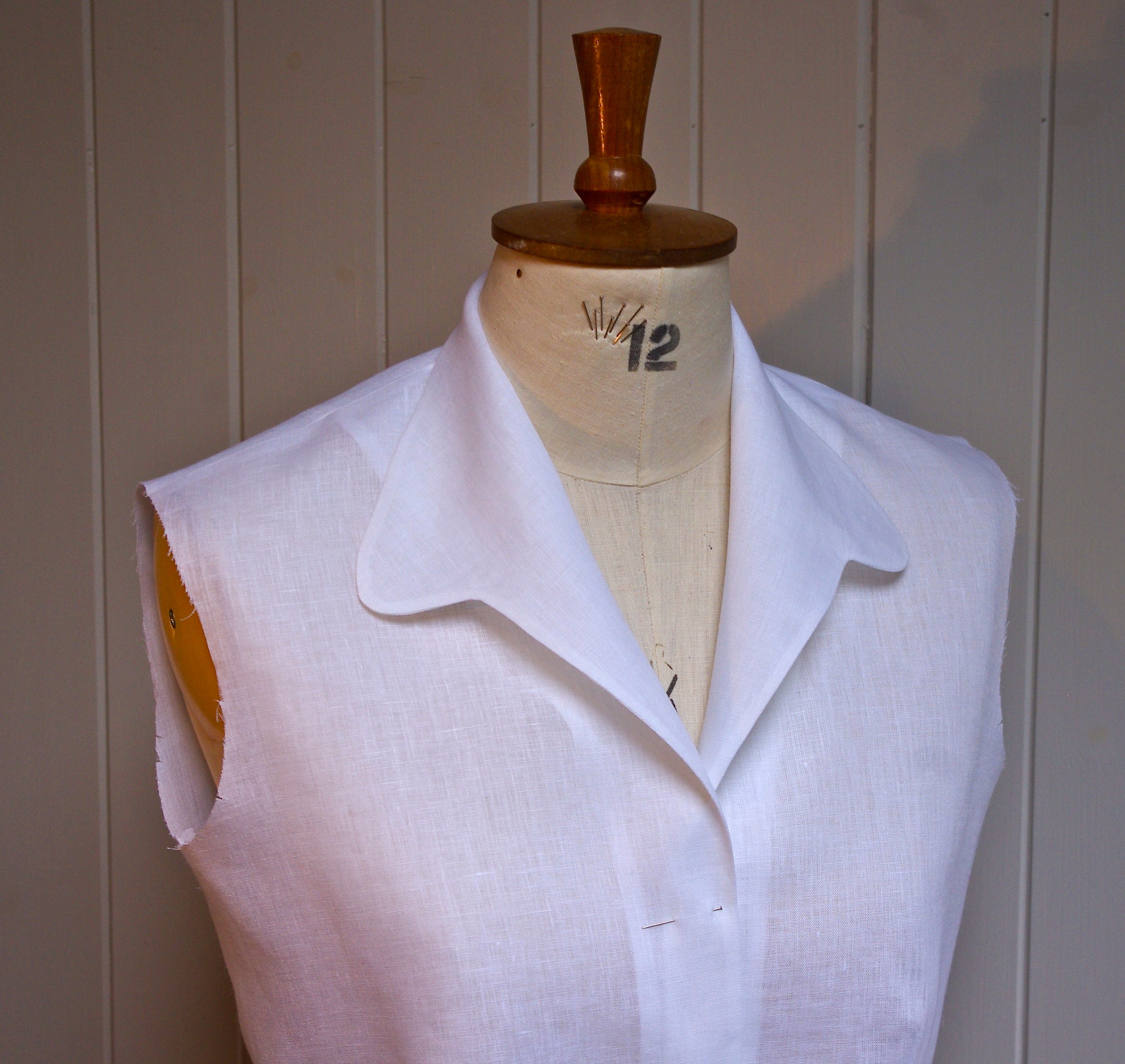 Collar and bodice front are all in one piece and includes the back neck. So when the garment is made up there is a centre back seam in the collar.