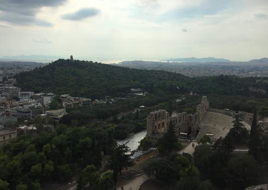 From the top of the Acropolis, the ancient Athenians had a strategic view of three of the central components of their success as a society: the theatre of Odeon of Herodes Atticus, Pnyx hill, and the Saronic Gulf beyond. Image credit: Sofia Kalogirou