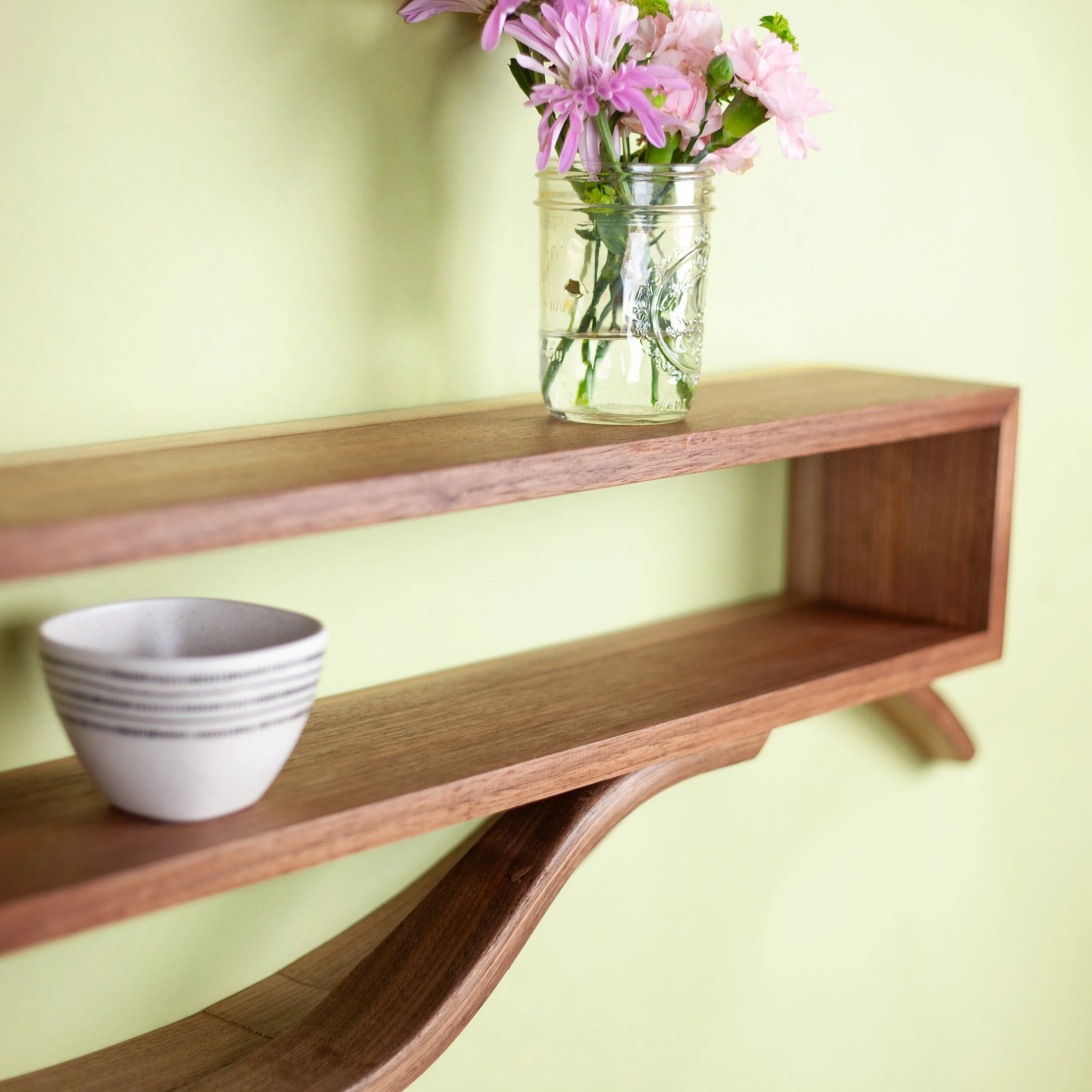 Floating walnut shelves