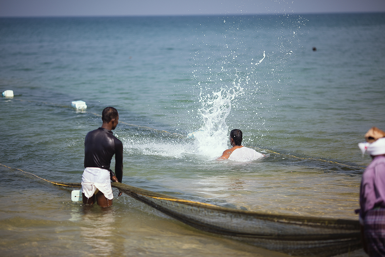 Slapping the water is to drive the fish into the back of the net as they are dragged onto the beach, it stops the fish escaping out of the sides and front of the nets. This was done very energetically and soulfully with chanting, singing and laughing.