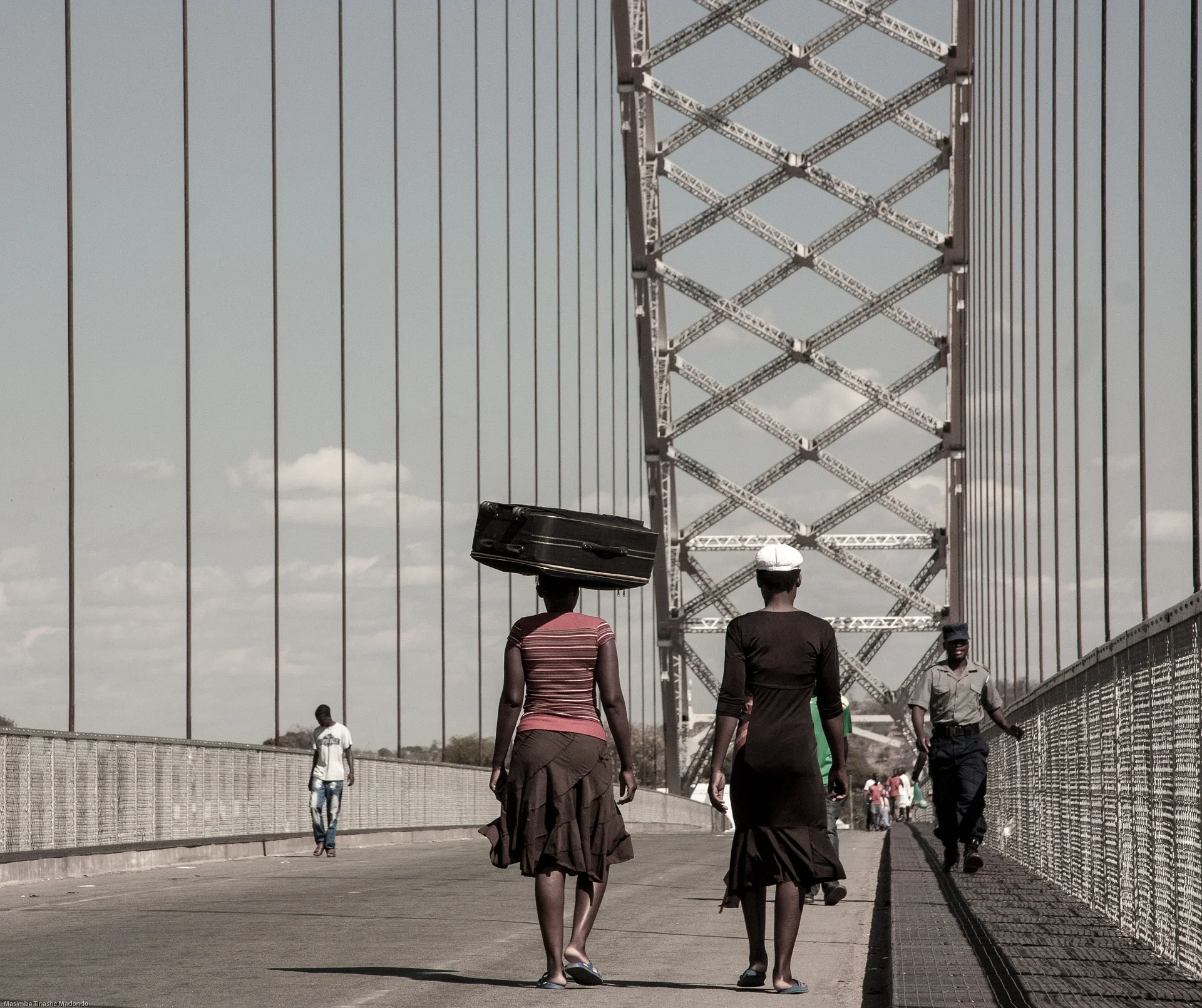Citizens crossing a bridge. Mozambique’s new Maputo-Catembe bridge is an example of an infrastructural investment that can facilitate increased mobility, better transport and economic benefits. Photo credit: 1388843