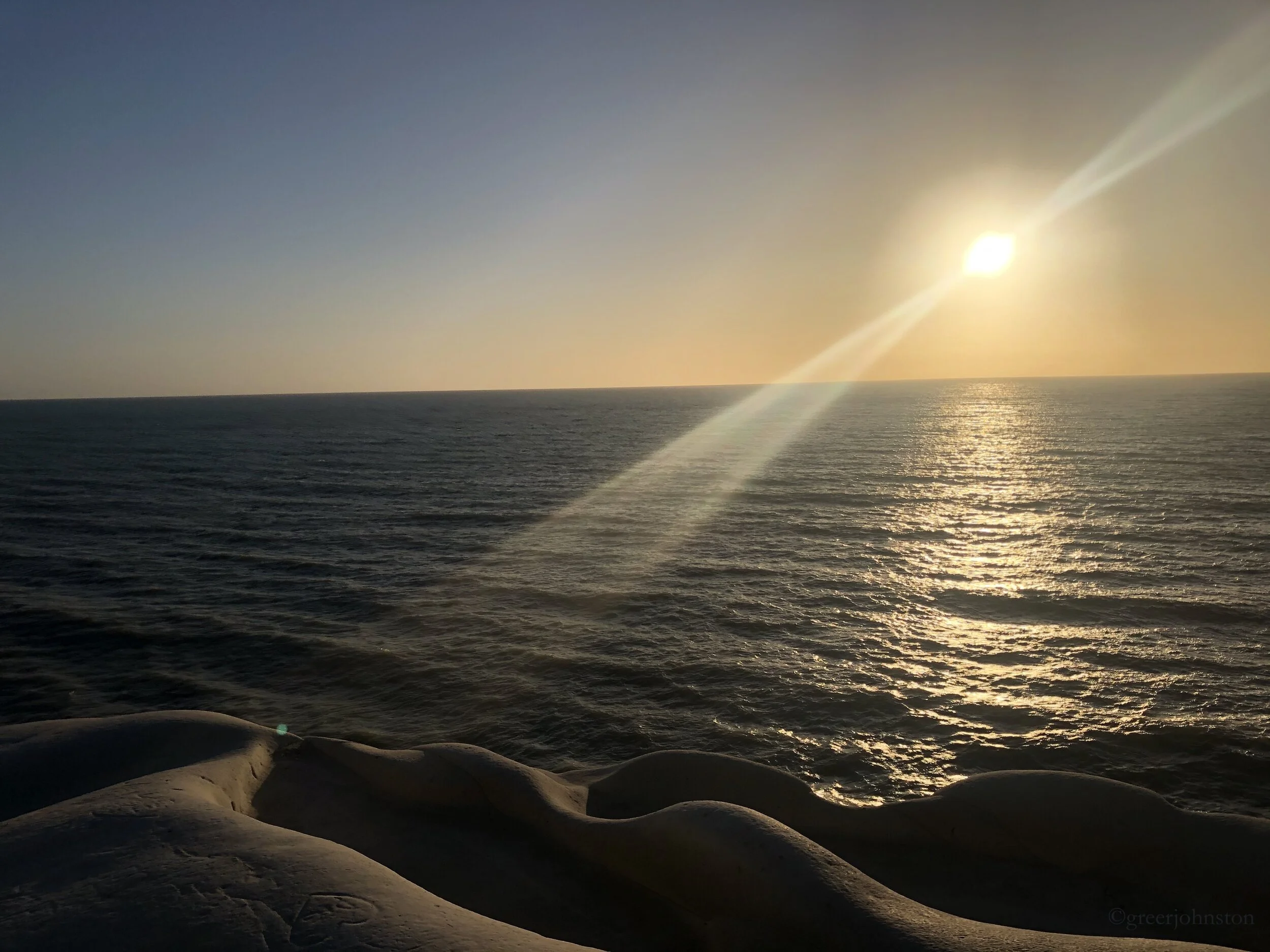 Watching the sunset over the Mediterranean Sea from La Scala dei Turchi