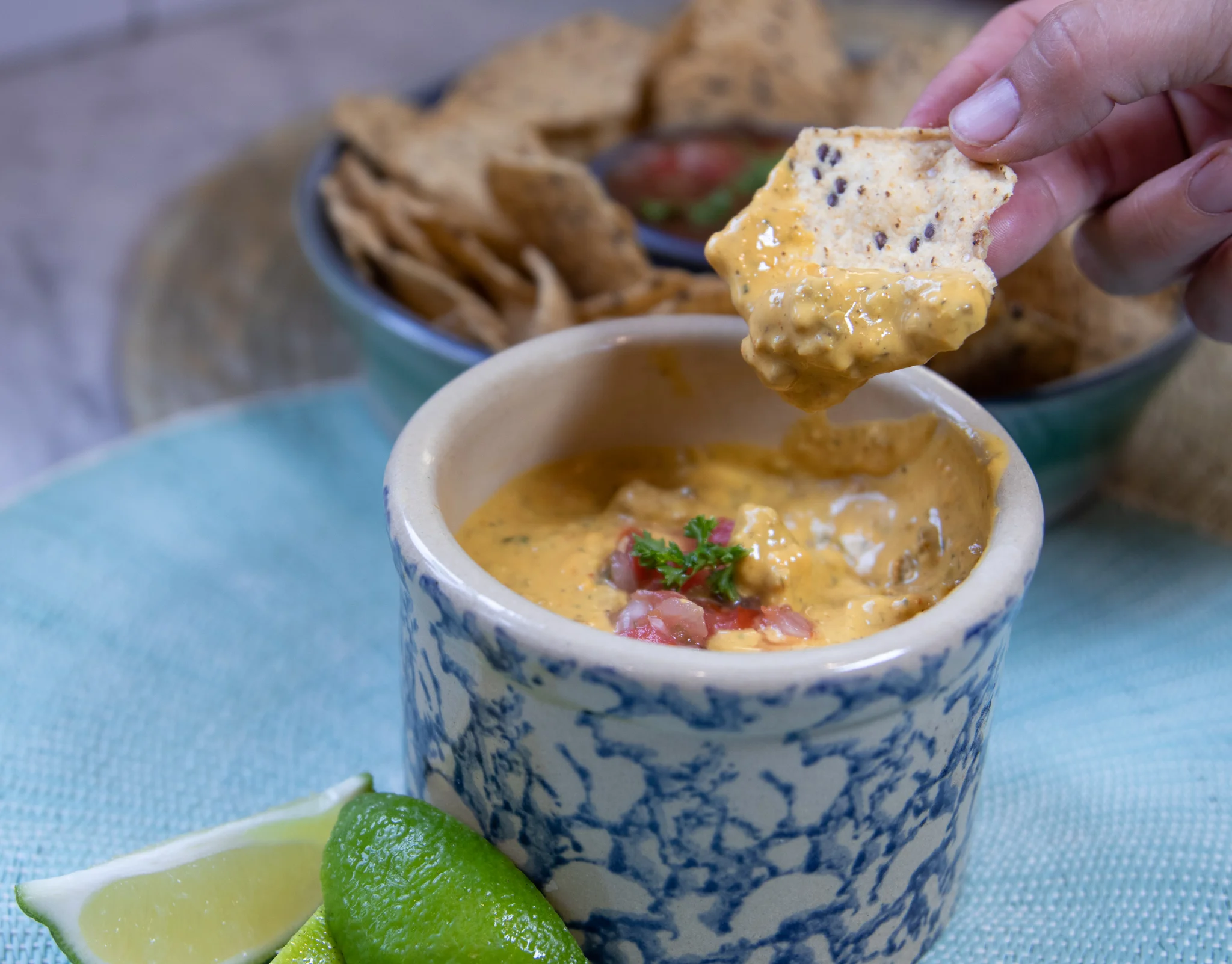 In college I waited tables at popular casual dinning restaurant. Not naming names, but one of our jingles involved baby baby ribs, and customers thought it was hilarious to ask us to sing it. But hey, the job got me through college! One of our most popular appetizers was a chili queso dip in a skillet, and I probably ate my weight in this dip before I was vegan. I have not eaten that dip in forever, but I think of it often and knew I needed to try and create a vegan version. This one did not disappoint, and I can still eat my weight in it! You can use any store bought meatless crumble, vegan sausage, or you could even use your own vegan crumble recipe. I love to roll up warm flour tortillas and dip them into this cheesy, spicy, magic! It also makes a delicious enchilada or quesadilla filling!!