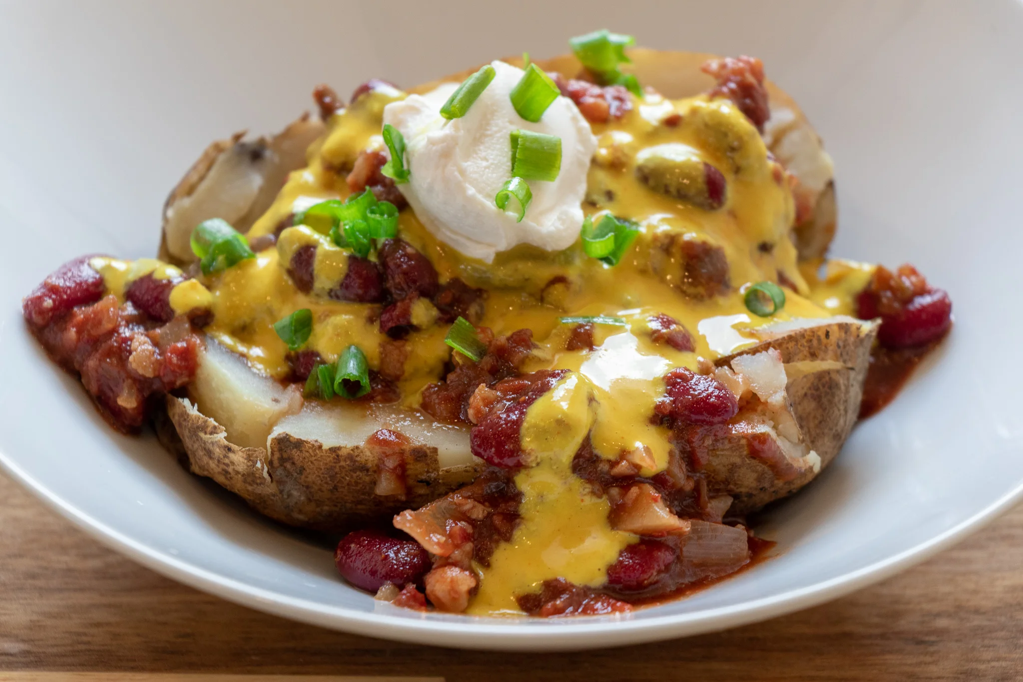 Every time I make a batch of my vegan chili, I freeze the leftovers in smaller freezer bags so I can thaw them quickly for an easy weeknight dinner, like chili cheese baked potatoes. So yummy and satisfying, and so fast to throw together when you are pressed for time!