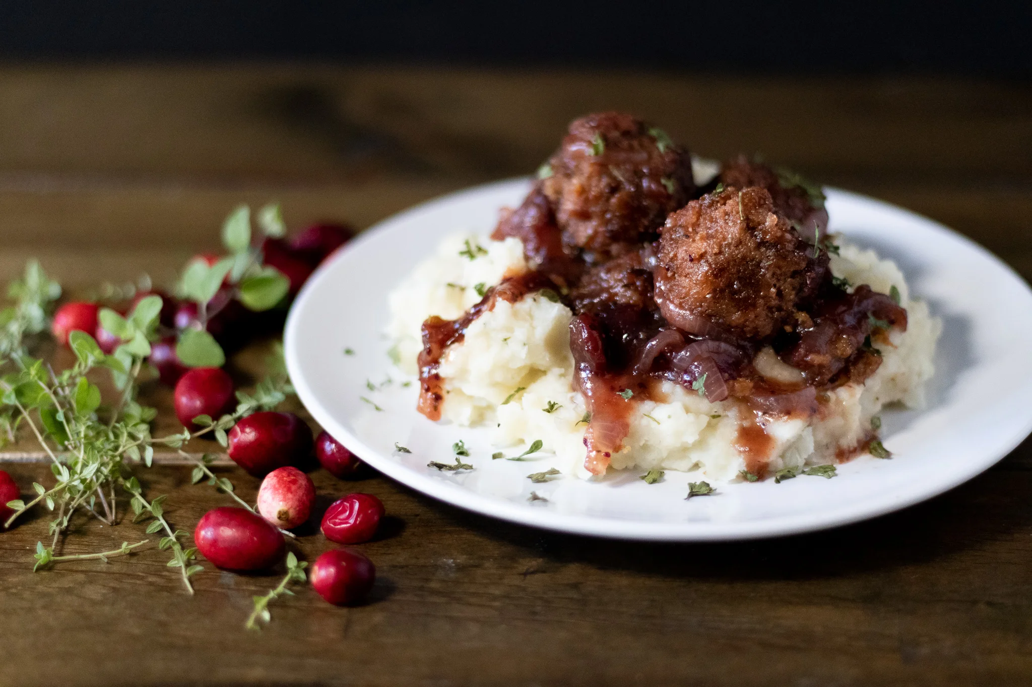 I often make meatballs wth thawed Beyond Meat Burgers . They work very well as a meat substitute in all kinds of recipes other than just using them as burgers. Once thawed, they can be used just as you would ground meat. This particular recipe is sweet, tangy, and savory. The sauce screams holidays, and would make a perfect alternative to a traditional holiday meal. The cranberries, onion, and savory spices make such a beautiful sauce for the meatballs, and wonderful topping for the mashed potatoes. You can just as easily use a bag of frozen plant based meatballs, but I really encourage you to try a batch using the Beyond Burgers!