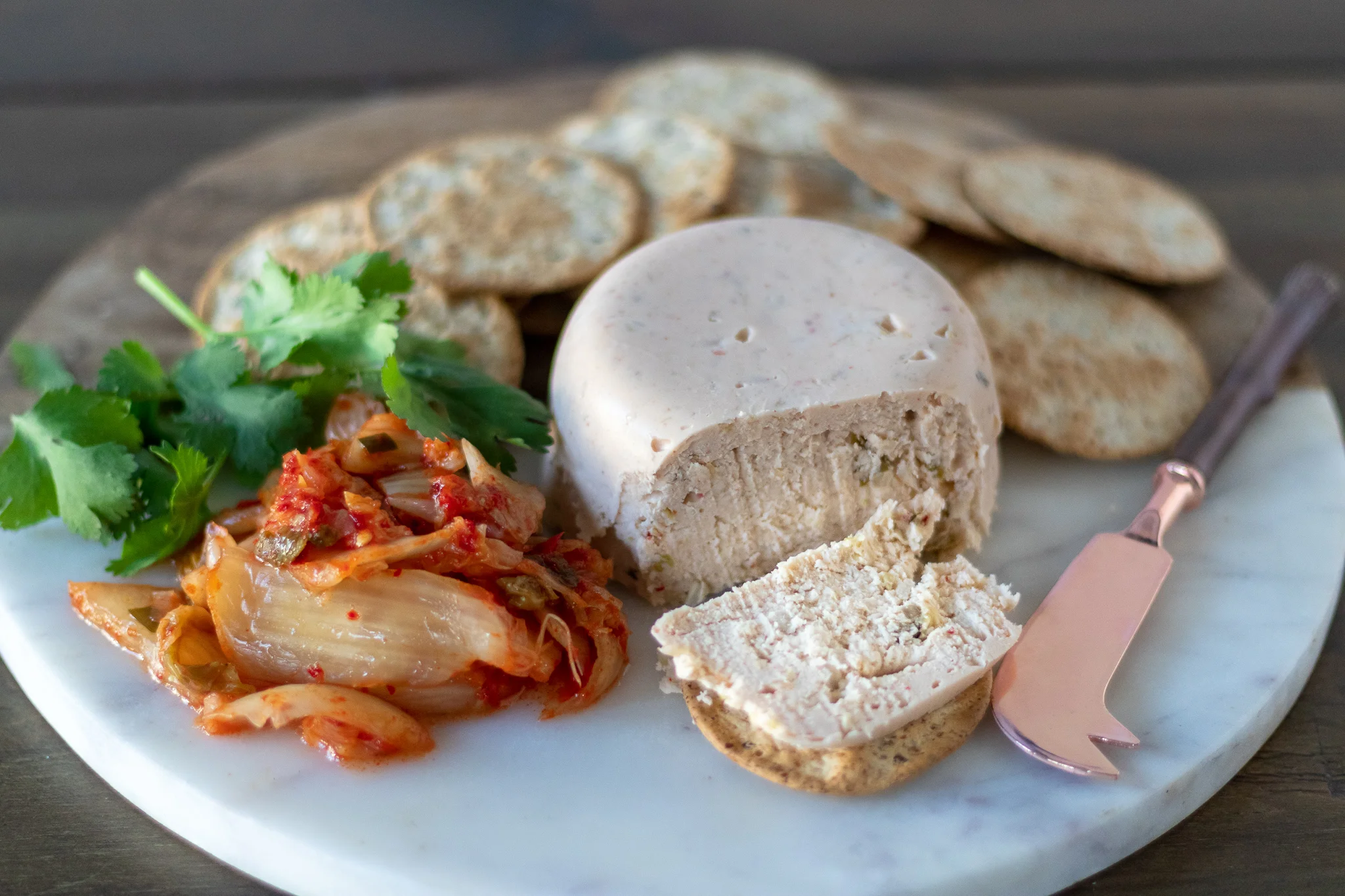 I can eat an entire jar of kimchi by myself in a week, and often do. I can also eat my weight in vegan cheese if given the chance. So for me, mixing the two was a no brainer, and so I introduce to you KIMCHEESE! I often add sauerkraut to my vegan cheese recipes to give them that cheesy zip, and kimchi works just as well! This cheese is tangy, spicy, quick and easy, but most importantly it is DELICIOUS! Even my husband who swears he does not like kimchi, inhaled this one! This vegan cheese will shred, slice and melt, so It will work beautifully for snacking, salads, or even the best grilled cheese you may ever eat! If you can not find agar powder locally, check our pantry staples for a link to order on amazon prime!