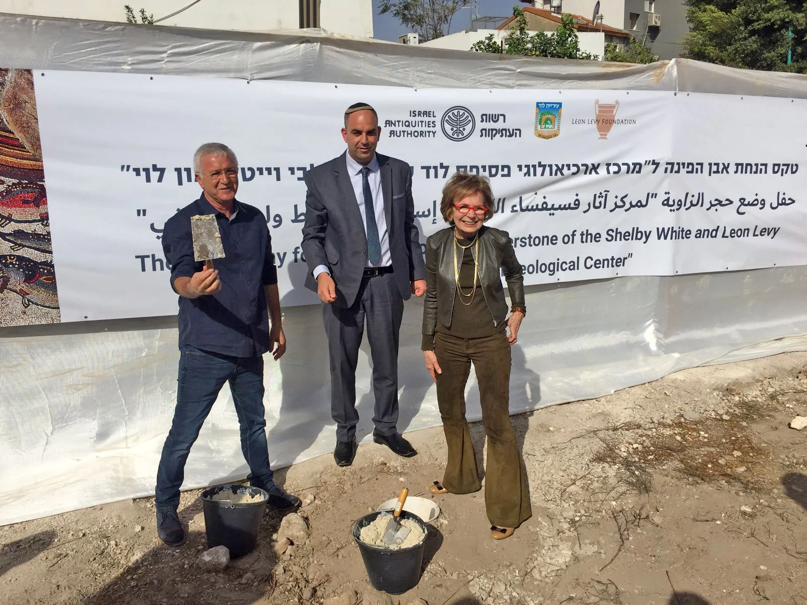 Israel Hasson, Yair Revivo and Shelby White (L-R), laying the cornerstone.