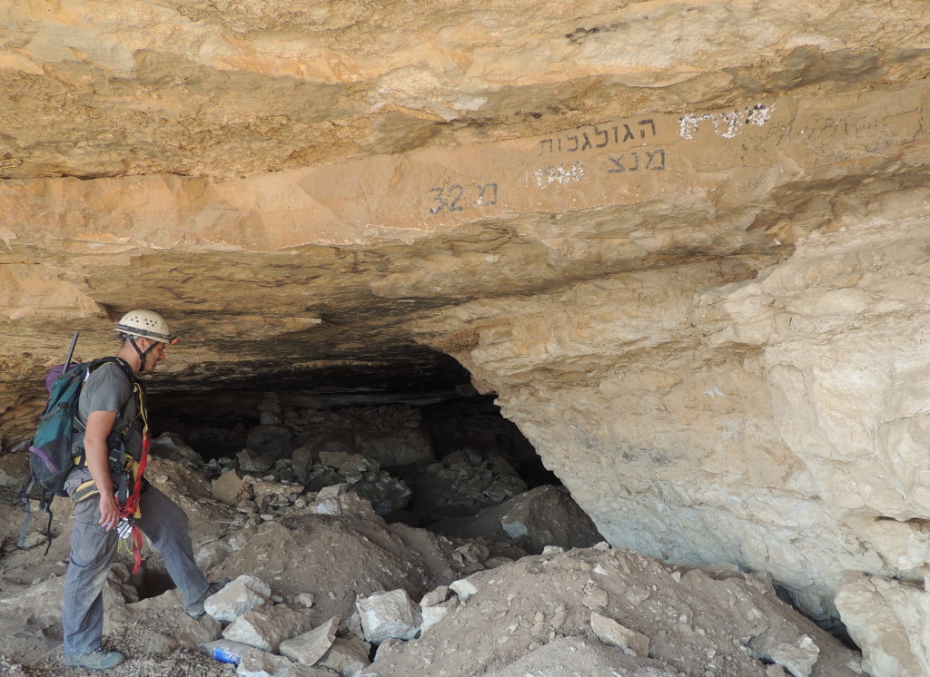 Inspecting 'Skulls Cave' in the Judean Desert after catching a gang looting remains within.