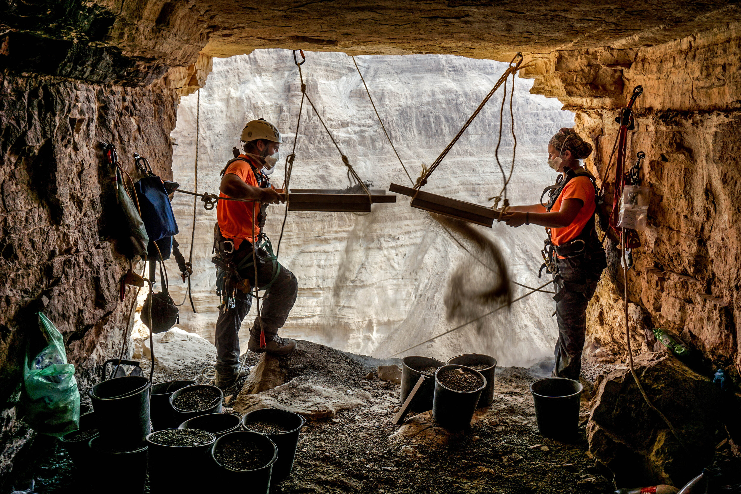 10.Archeologists Hagay Hamer and Oriah Amichai sifting finds at the Horro Cave. Eitan Klein Israel Antiquities Authority.jpg