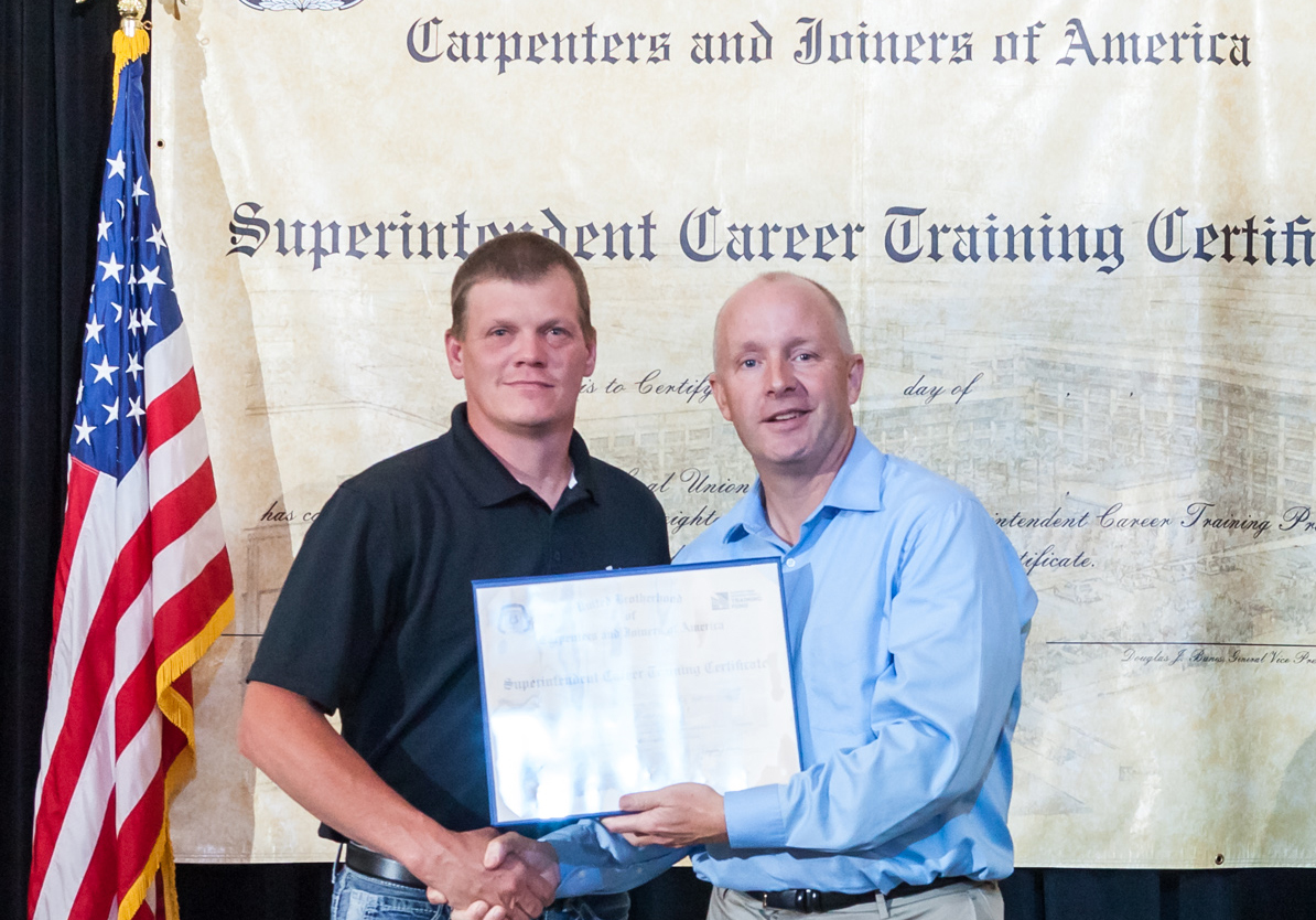Pangere employee accepting certification