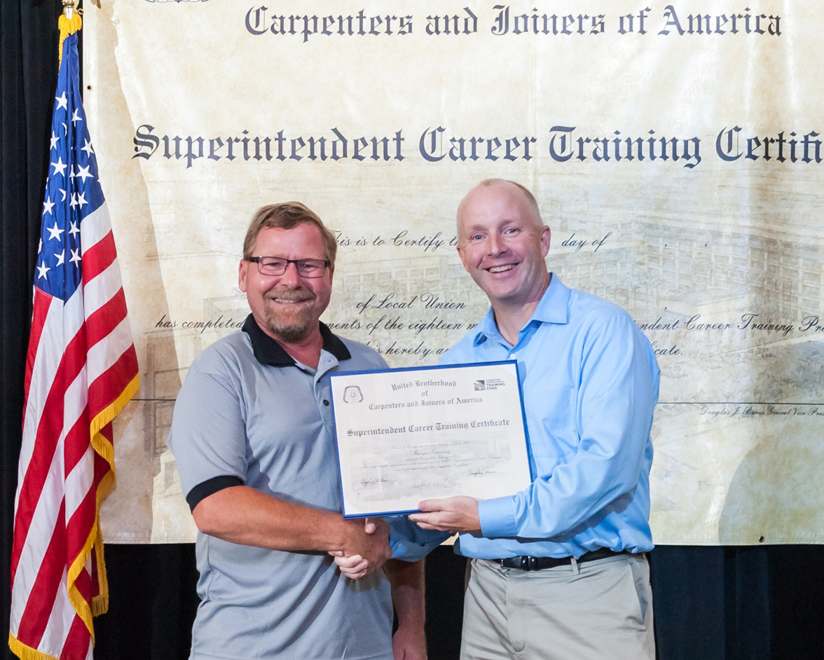 Pangere employee accepting certification
