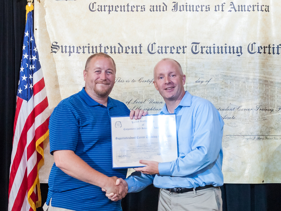 Pangere employee accepting certification
