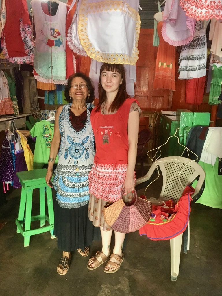 Purchasing beautiful handmade aprons from this sweet abuela