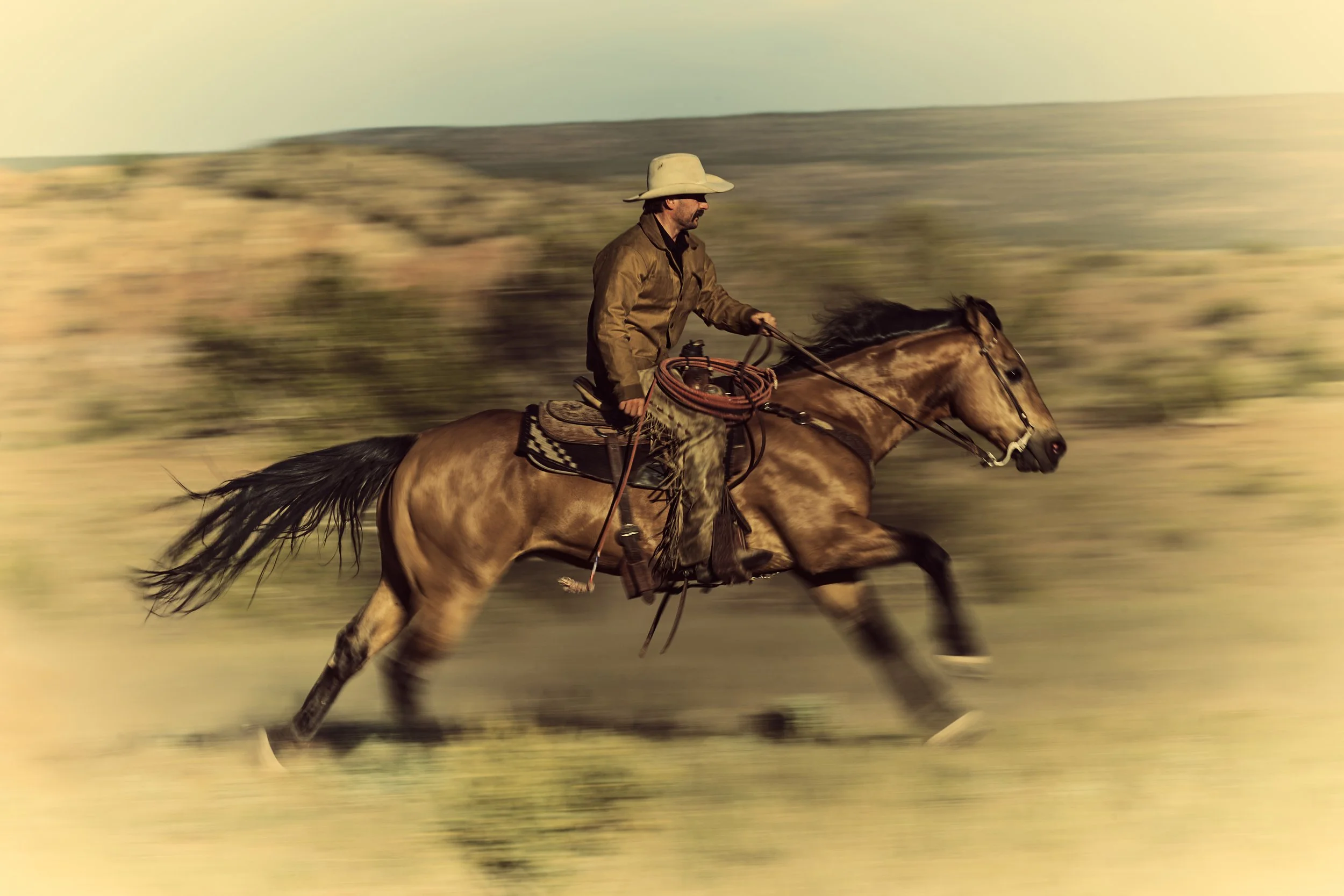 Cowboy galloping on horse