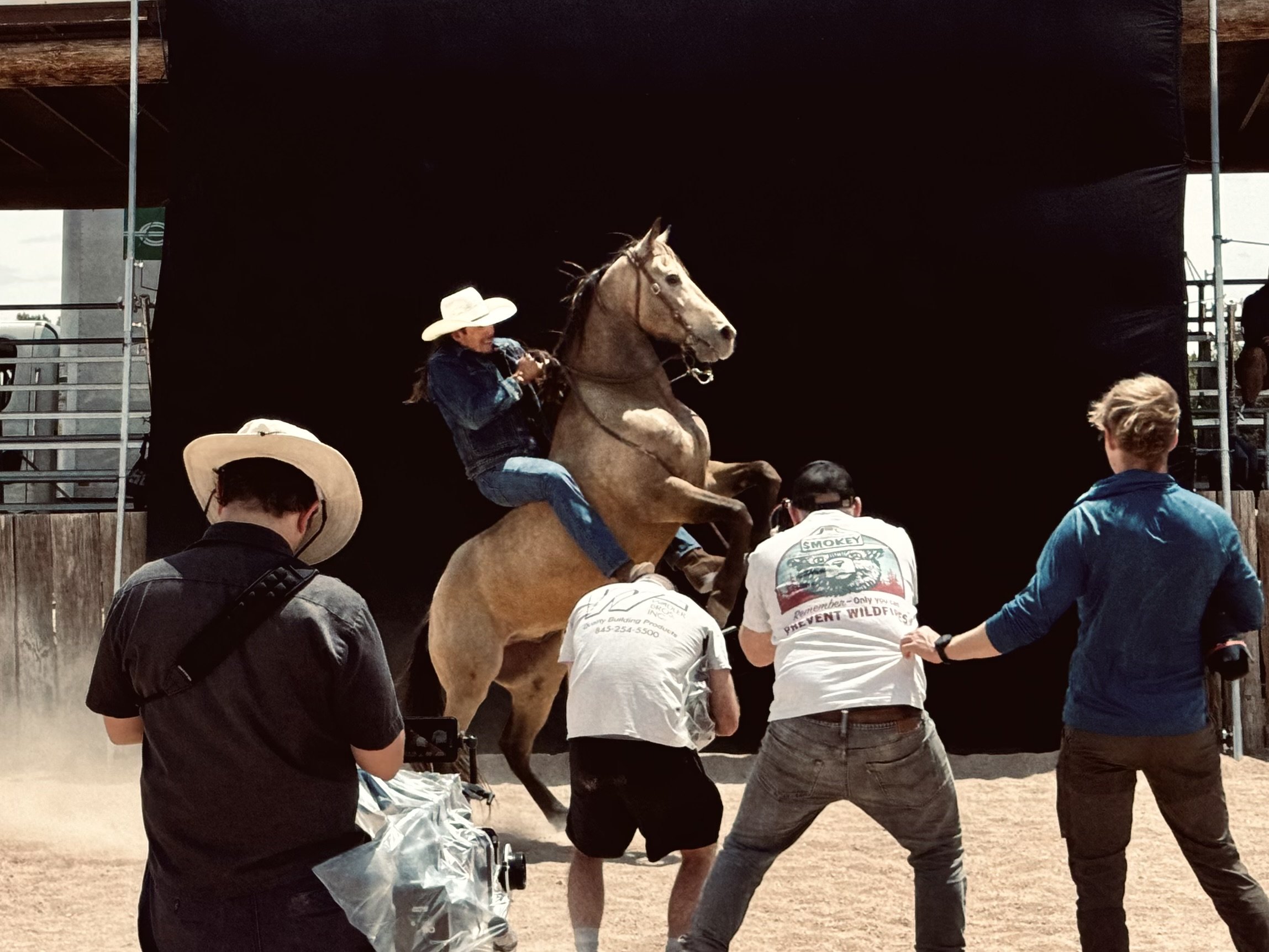 Film crew shooting stuntman and his horse