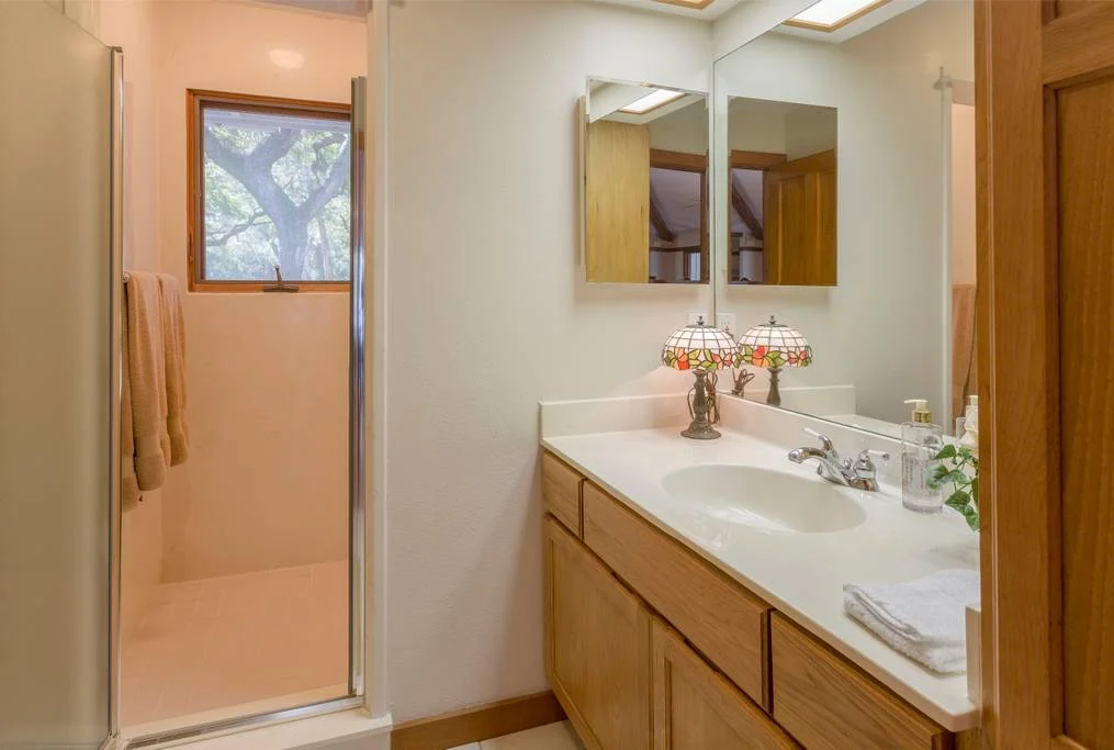 Private bathroom adjacent to the Rejuvenate room equipped with a walk-in shower.