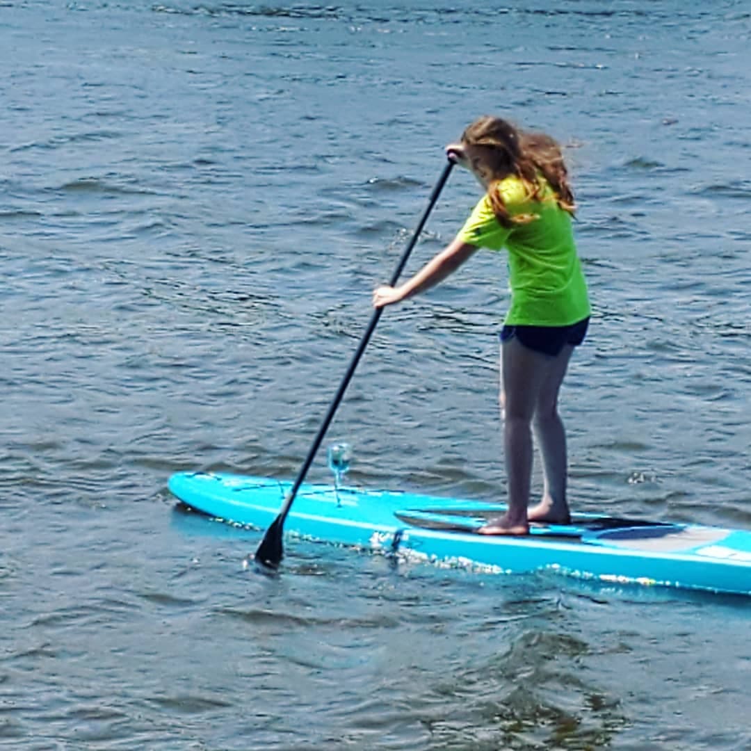 Woman riding paddle board