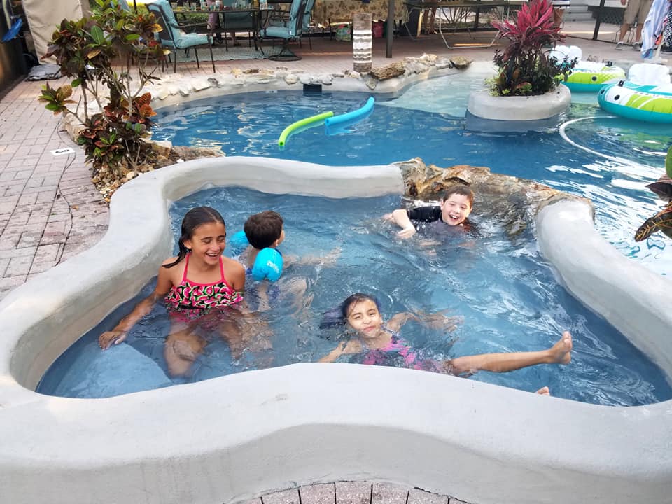 Kids having fun in the tropical pool