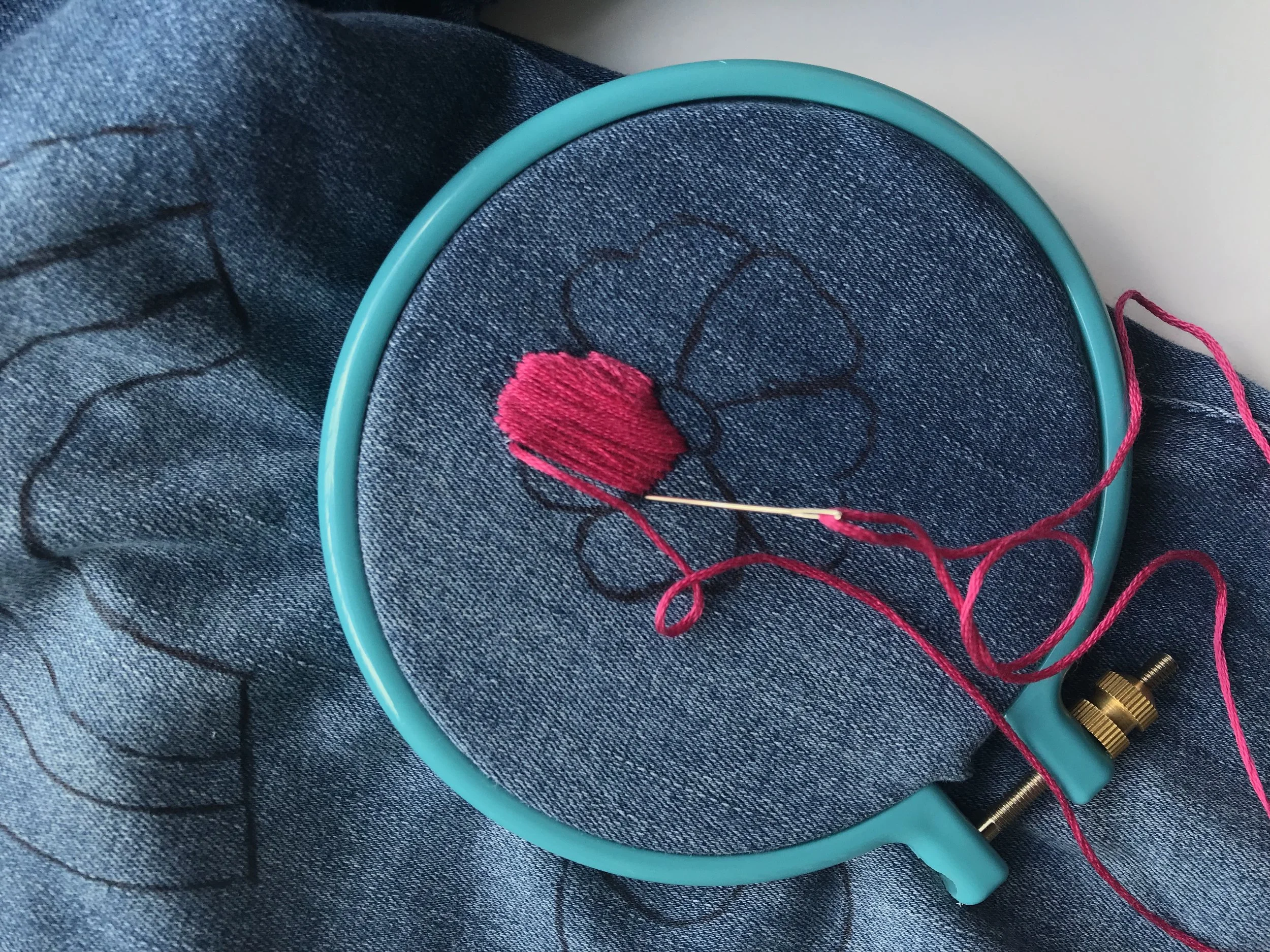 Place the embroidery hoop around your design and begin stitching. I used a straight stitch for this flower. Next time; I’ll probably use 3 out of the 6 threads for a flatter look.