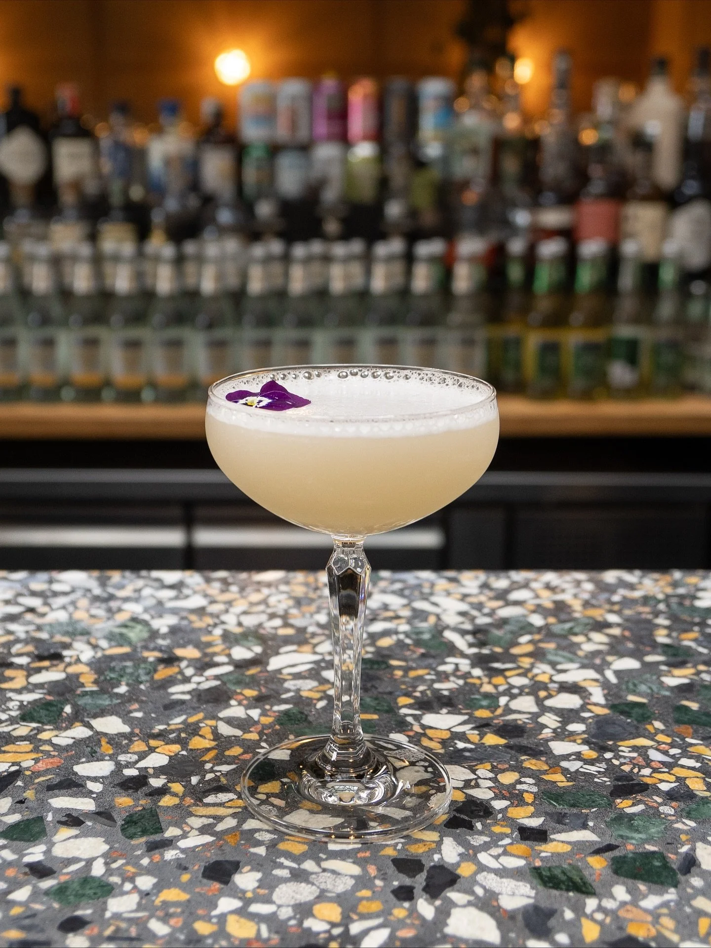floral, citrusy, sophisticated,
just what you want to sip on the terrace. 

sip of theseus
white rum,
cr&egrave;me de violette,
lemon,
lavender.